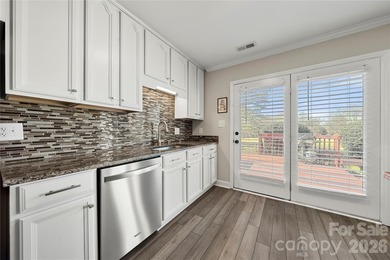 Welcome to 8615 Golf Ridge Drive, an updated ranch-style home on Raintree Country Club in North Carolina - for sale on GolfHomes.com, golf home, golf lot