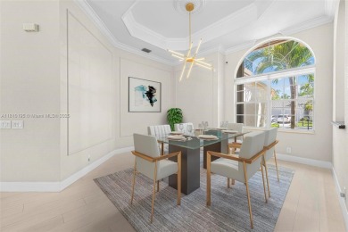 Luxury living awaits in this stunning one-story pool home on the on Weston Hills Country Club in Florida - for sale on GolfHomes.com, golf home, golf lot