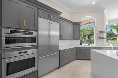Luxury living awaits in this stunning one-story pool home on the on Weston Hills Country Club in Florida - for sale on GolfHomes.com, golf home, golf lot