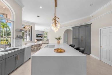 Luxury living awaits in this stunning one-story pool home on the on Weston Hills Country Club in Florida - for sale on GolfHomes.com, golf home, golf lot