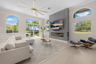 Luxury living awaits in this stunning one-story pool home on the on Weston Hills Country Club in Florida - for sale on GolfHomes.com, golf home, golf lot