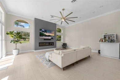 Luxury living awaits in this stunning one-story pool home on the on Weston Hills Country Club in Florida - for sale on GolfHomes.com, golf home, golf lot