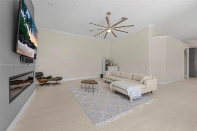 Luxury living awaits in this stunning one-story pool home on the on Weston Hills Country Club in Florida - for sale on GolfHomes.com, golf home, golf lot