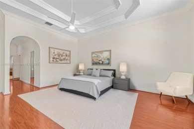 Luxury living awaits in this stunning one-story pool home on the on Weston Hills Country Club in Florida - for sale on GolfHomes.com, golf home, golf lot