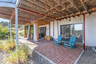 Discover your dream home on nearly an acre of fenced land with on Pueblo de Cochiti Golf Course in New Mexico - for sale on GolfHomes.com, golf home, golf lot