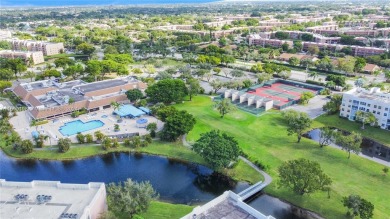 Imagine starting each day in a meticulously designed 3-bedroom on Sunrise Lakes Phase IV Golf Course in Florida - for sale on GolfHomes.com, golf home, golf lot