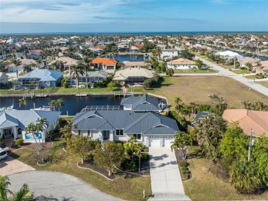 Stunning WATERFRONT home is located on an oversized lot in a on Saint Andrews South Golf Club in Florida - for sale on GolfHomes.com, golf home, golf lot