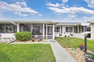 Beautiful one-story villa located in a desirable 24-hour manned on Cypress Lakes Golf Course - West Palm Beach in Florida - for sale on GolfHomes.com, golf home, golf lot