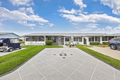 Beautiful one-story villa located in a desirable 24-hour manned on Cypress Lakes Golf Course - West Palm Beach in Florida - for sale on GolfHomes.com, golf home, golf lot