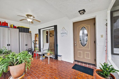 Beautiful one-story villa located in a desirable 24-hour manned on Cypress Lakes Golf Course - West Palm Beach in Florida - for sale on GolfHomes.com, golf home, golf lot