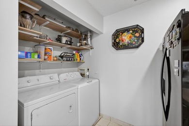 Beautiful one-story villa located in a desirable 24-hour manned on Cypress Lakes Golf Course - West Palm Beach in Florida - for sale on GolfHomes.com, golf home, golf lot