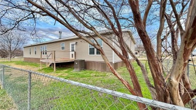 Embrace the charm of lakeside living with this impressive on Links At Lands End in Texas - for sale on GolfHomes.com, golf home, golf lot