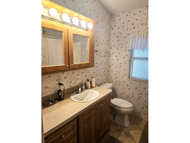 Welcome to 290 Doubles Lane, located in the 55+ Coop Regal Ridge on Deer Creek RV Golf Resort in Florida - for sale on GolfHomes.com, golf home, golf lot