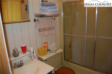 Nestled in the rhododendrons, you'll find this 2bdr/2bath on Land Harbor Golf Course in North Carolina - for sale on GolfHomes.com, golf home, golf lot