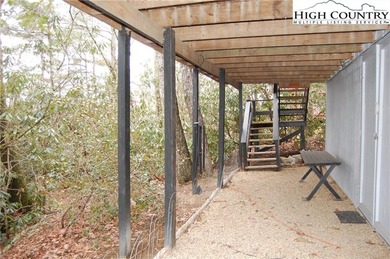 Nestled in the rhododendrons, you'll find this 2bdr/2bath on Land Harbor Golf Course in North Carolina - for sale on GolfHomes.com, golf home, golf lot