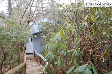 Nestled in the rhododendrons, you'll find this 2bdr/2bath on Land Harbor Golf Course in North Carolina - for sale on GolfHomes.com, golf home, golf lot