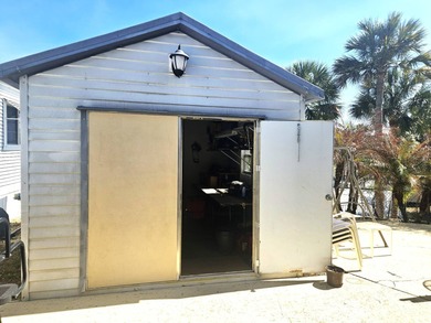 Welcome to 290 Doubles Lane, located in the 55+ Coop Regal Ridge on Deer Creek RV Golf Resort in Florida - for sale on GolfHomes.com, golf home, golf lot