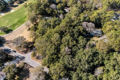 Nestled in the heart of Pawleys Plantation, this private corner on Pawleys Plantation Golf and Country Club in South Carolina - for sale on GolfHomes.com, golf home, golf lot