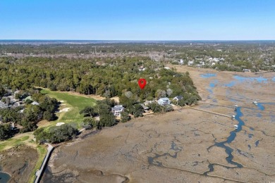 Nestled in the heart of Pawleys Plantation, this private corner on Pawleys Plantation Golf and Country Club in South Carolina - for sale on GolfHomes.com, golf home, golf lot