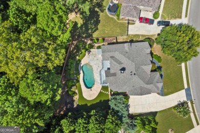 Welcome to this stunning 7-bedroom, 5.5-bathroom home boasting 6 on Bridgemill Golf Club in Georgia - for sale on GolfHomes.com, golf home, golf lot