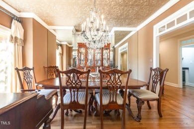 Experience luxury living where waterfront serenity meets golf on Country Club of Johnston County in North Carolina - for sale on GolfHomes.com, golf home, golf lot