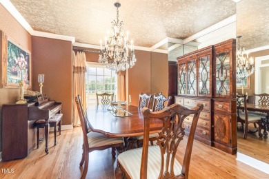 Experience luxury living where waterfront serenity meets golf on Country Club of Johnston County in North Carolina - for sale on GolfHomes.com, golf home, golf lot