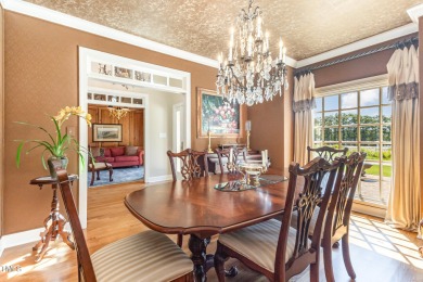 Experience luxury living where waterfront serenity meets golf on Country Club of Johnston County in North Carolina - for sale on GolfHomes.com, golf home, golf lot