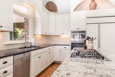 Experience luxury living where waterfront serenity meets golf on Country Club of Johnston County in North Carolina - for sale on GolfHomes.com, golf home, golf lot