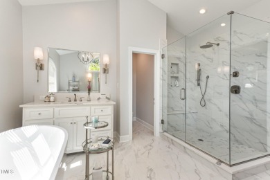Experience luxury living where waterfront serenity meets golf on Country Club of Johnston County in North Carolina - for sale on GolfHomes.com, golf home, golf lot