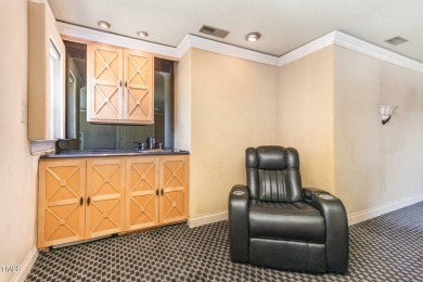 Experience luxury living where waterfront serenity meets golf on Country Club of Johnston County in North Carolina - for sale on GolfHomes.com, golf home, golf lot