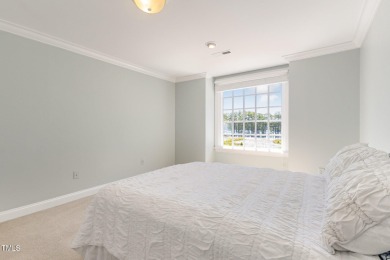 Experience luxury living where waterfront serenity meets golf on Country Club of Johnston County in North Carolina - for sale on GolfHomes.com, golf home, golf lot