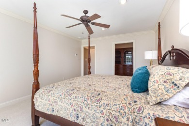 Experience luxury living where waterfront serenity meets golf on Country Club of Johnston County in North Carolina - for sale on GolfHomes.com, golf home, golf lot