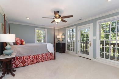 Experience luxury living where waterfront serenity meets golf on Country Club of Johnston County in North Carolina - for sale on GolfHomes.com, golf home, golf lot