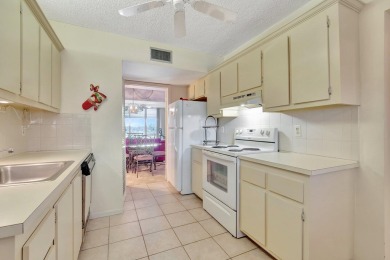 Step inside this beautiful, spacious 4th floor apartment and you on Poinciana Golf Club in Florida - for sale on GolfHomes.com, golf home, golf lot