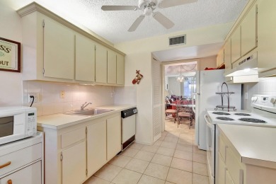 Step inside this beautiful, spacious 4th floor apartment and you on Poinciana Golf Club in Florida - for sale on GolfHomes.com, golf home, golf lot
