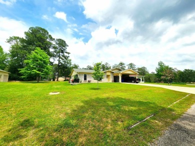 A beautifully landscaped and well taken care of 3 bed & 2 bath on Rayburn Country Club in Texas - for sale on GolfHomes.com, golf home, golf lot