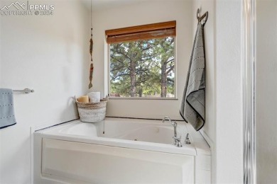 Custom-built ranch home nestled on a private 1+ acre lot w/easy on Shining Mountain Golf Club in Colorado - for sale on GolfHomes.com, golf home, golf lot