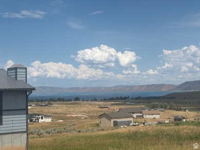 Enjoy elevated views of Bear Lake and the surrounding mountains on Bear Lake Golf Course in Utah - for sale on GolfHomes.com, golf home, golf lot