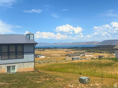 Enjoy elevated views of Bear Lake and the surrounding mountains on Bear Lake Golf Course in Utah - for sale on GolfHomes.com, golf home, golf lot
