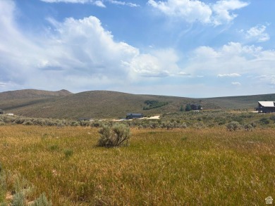 Enjoy elevated views of Bear Lake and the surrounding mountains on Bear Lake Golf Course in Utah - for sale on GolfHomes.com, golf home, golf lot