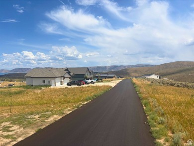 Enjoy elevated views of Bear Lake and the surrounding mountains on Bear Lake Golf Course in Utah - for sale on GolfHomes.com, golf home, golf lot