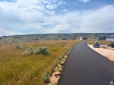 Enjoy elevated views of Bear Lake and the surrounding mountains on Bear Lake Golf Course in Utah - for sale on GolfHomes.com, golf home, golf lot