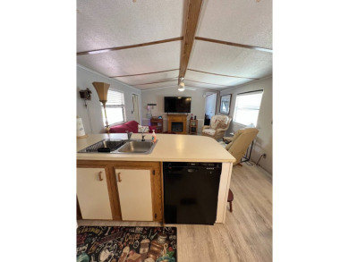 Charming 2 bed, 1.5 bath Home in 55+ Golf Community - New Roof on Lake Henry Golf Club in Florida - for sale on GolfHomes.com, golf home, golf lot