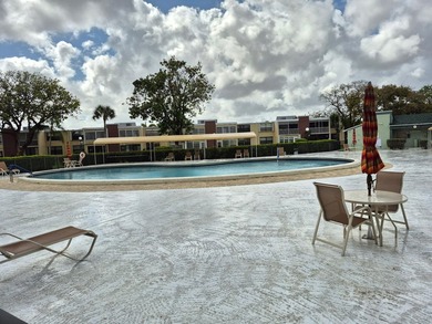 Enjoy the Florida lifestyle in this charming first-floor condo on  in Florida - for sale on GolfHomes.com, golf home, golf lot