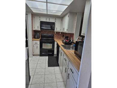 Enjoy the Florida lifestyle in this charming first-floor condo on  in Florida - for sale on GolfHomes.com, golf home, golf lot