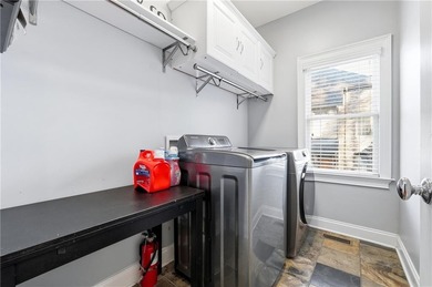 Experience luxury living at its finest with this stunning on Collins Hill Golf Club in Georgia - for sale on GolfHomes.com, golf home, golf lot