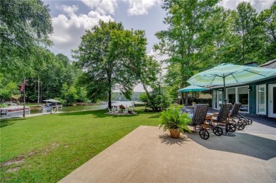 Embrace the outdoors with this expansive level yard and stunning on The Highlands Course at Lake Arrowhead in Georgia - for sale on GolfHomes.com, golf home, golf lot