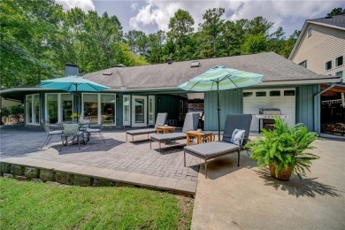 Embrace the outdoors with this expansive level yard and stunning on The Highlands Course at Lake Arrowhead in Georgia - for sale on GolfHomes.com, golf home, golf lot