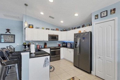 Designed to capture the best of its coastal locale, this on Pinemoor West Golf Club in Florida - for sale on GolfHomes.com, golf home, golf lot