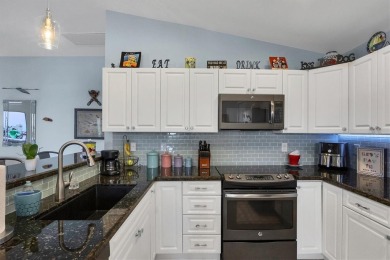 Designed to capture the best of its coastal locale, this on Pinemoor West Golf Club in Florida - for sale on GolfHomes.com, golf home, golf lot